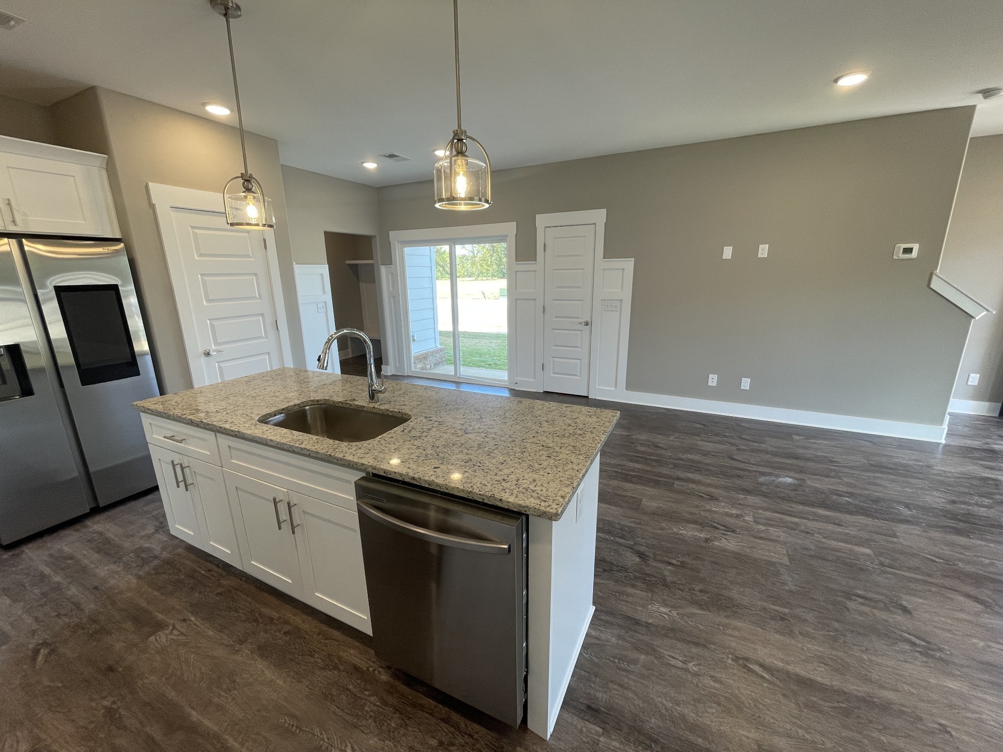 2114 Barringer Lane Murfreesboro, TN 37128 - Photo 8 of 17 a kitchen with stainless steel appliances granite countertop a sink a counter space and wooden floors