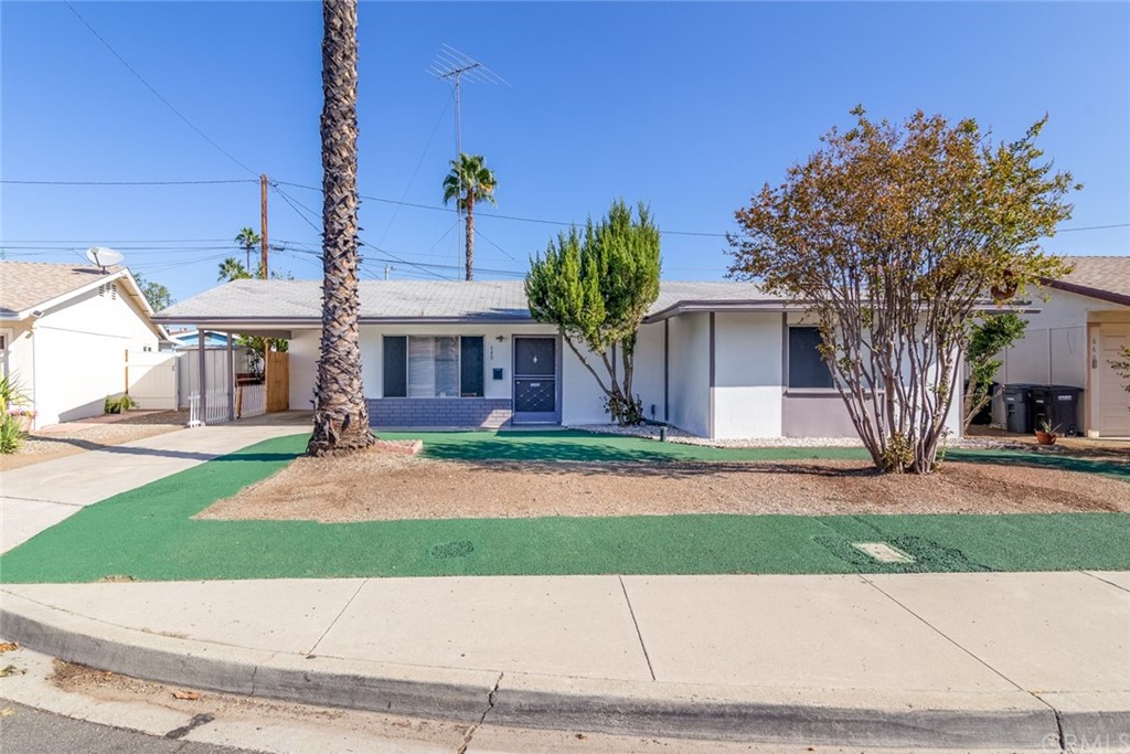 640 Snead Drive Hemet, CA 92543 - Photo 1 of 30 a front view of a house with a yard and garage