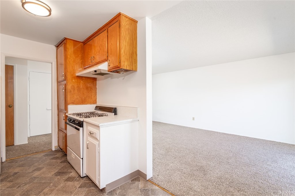 640 Snead Drive Hemet, CA 92543 - Photo 12 of 30 a kitchen with a stove and a cabinet