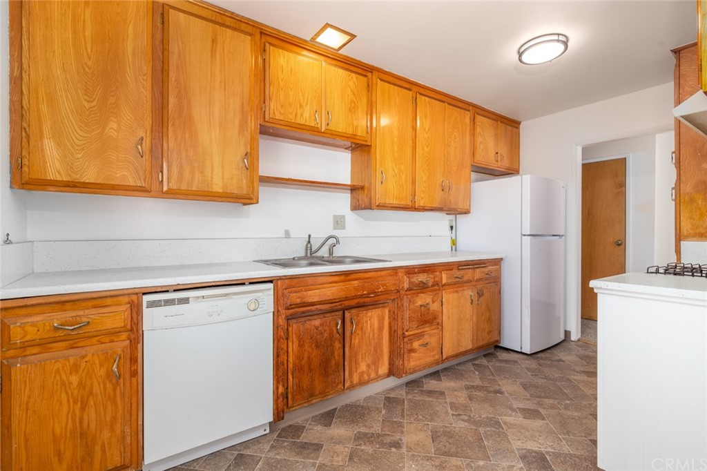 640 Snead Drive Hemet, CA 92543 - Photo 10 of 30 a kitchen with stainless steel appliances granite countertop a sink and cabinets