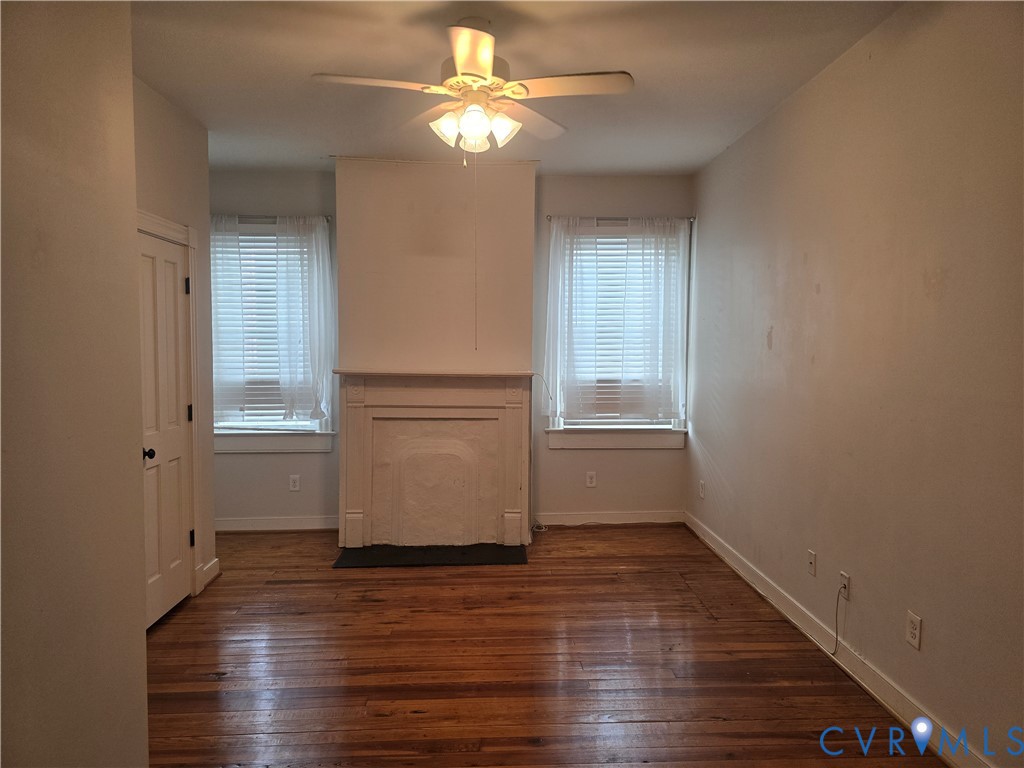 2106 Parkwood Avenue, Unit 1 Richmond, VA 23220 - Photo 11 of 20 a view of empty room with wooden floor and fan