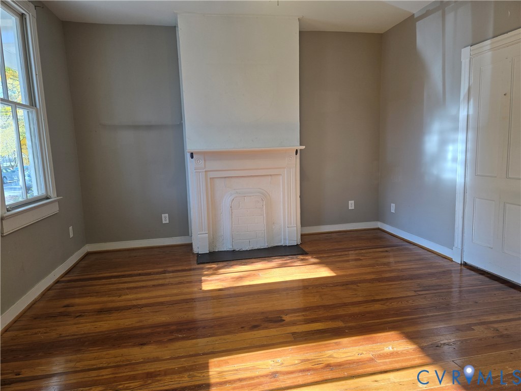 2106 Parkwood Avenue, Unit 1 Richmond, VA 23220 - Photo 19 of 20 a view of room with window and wooden floor