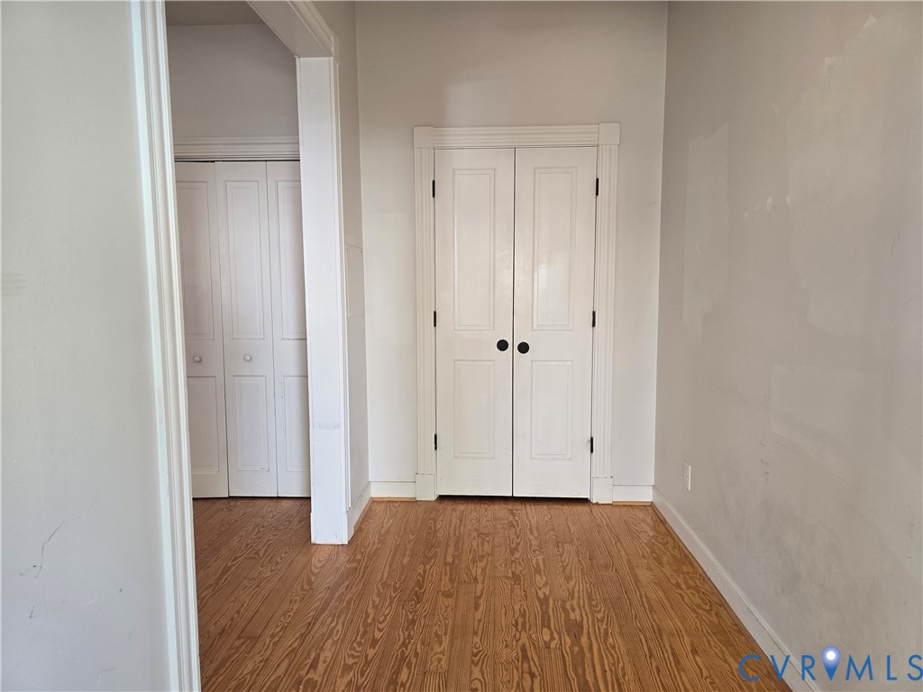 2106 Parkwood Avenue, Unit 1 Richmond, VA 23220 - Photo 6 of 20 a view of an empty room with wooden floor