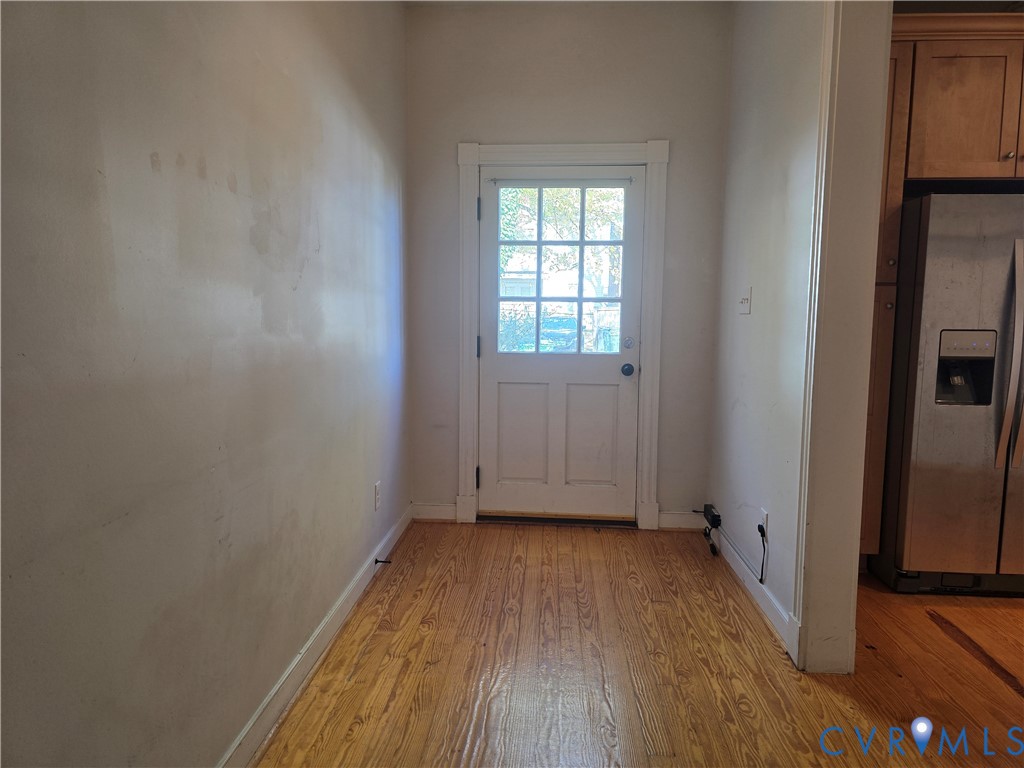 2106 Parkwood Avenue, Unit 1 Richmond, VA 23220 - Photo 7 of 20 an empty room with wooden floor and a window