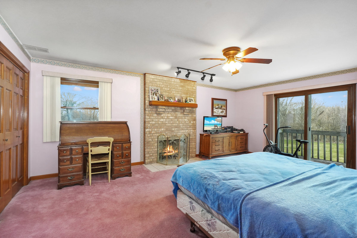 2 Valley View Drive Lemont, IL 60439 - Photo 17 of 36 a bedroom with a bed and a television