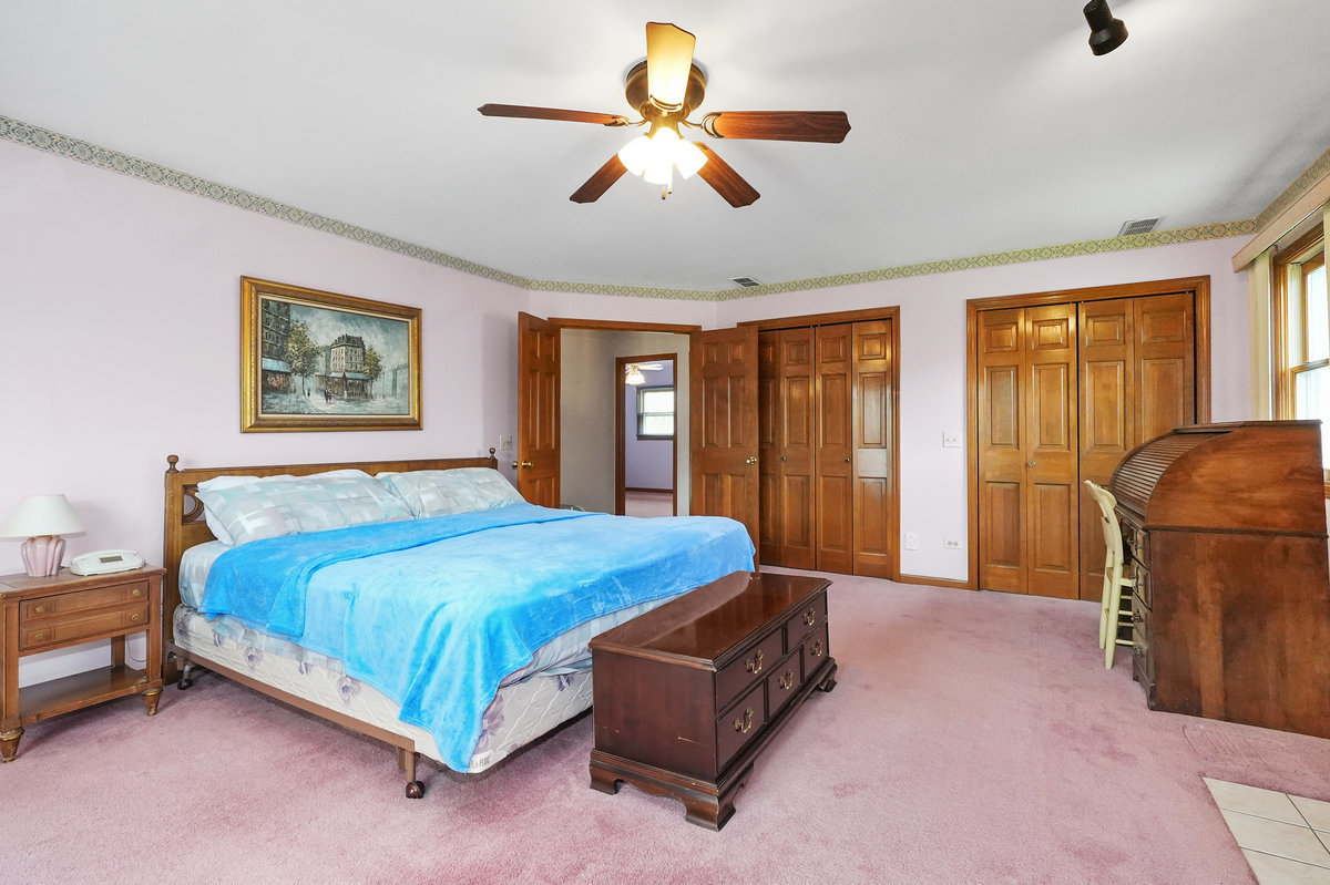 2 Valley View Drive Lemont, IL 60439 - Photo 18 of 36 a bedroom with a bed and window