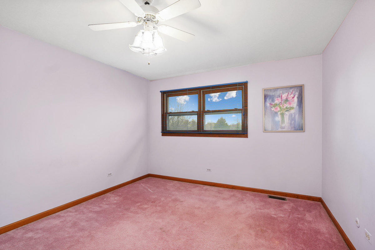 2 Valley View Drive Lemont, IL 60439 - Photo 23 of 36 an empty room with windows and fan