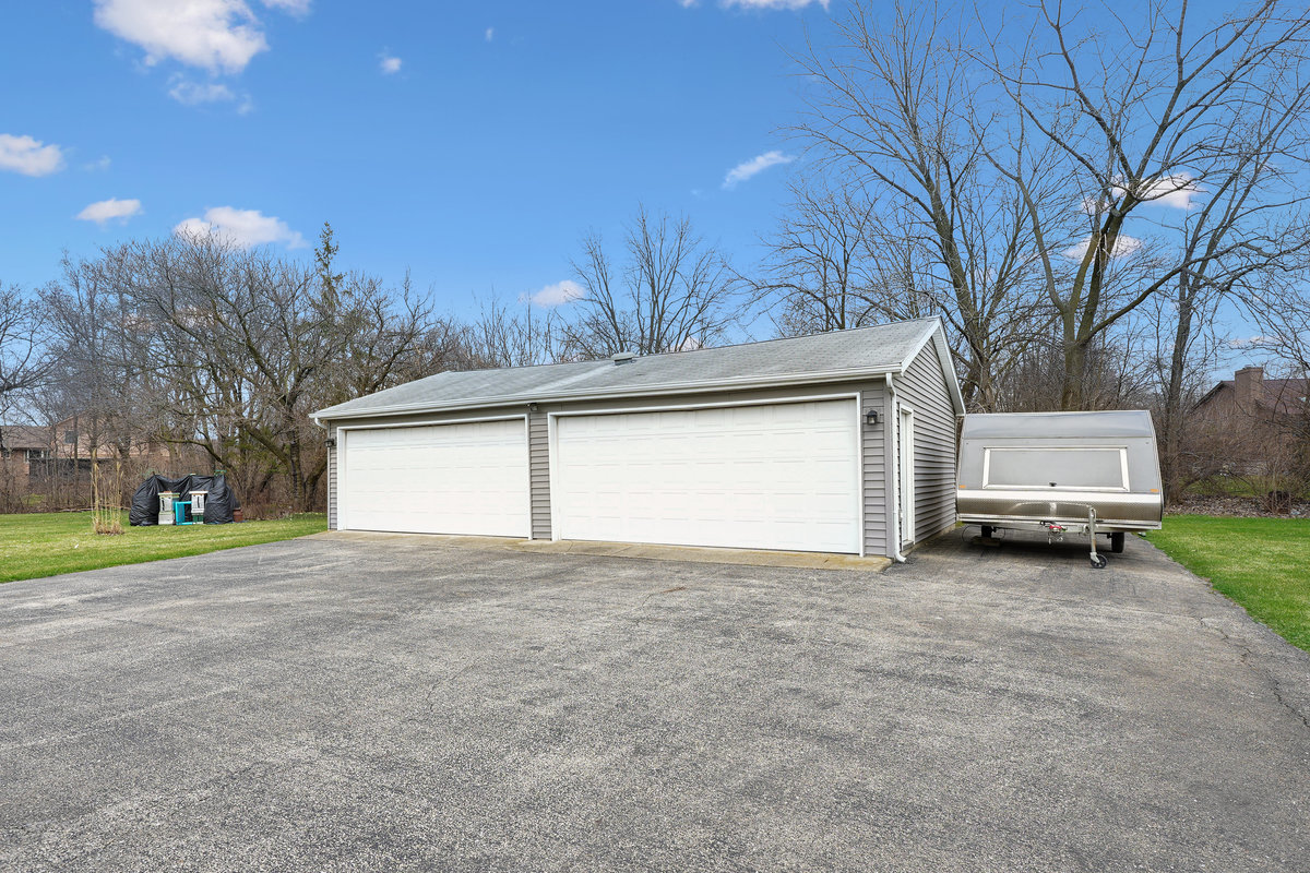 2 Valley View Drive Lemont, IL 60439 - Photo 29 of 36 a view of a house with a yard and garage