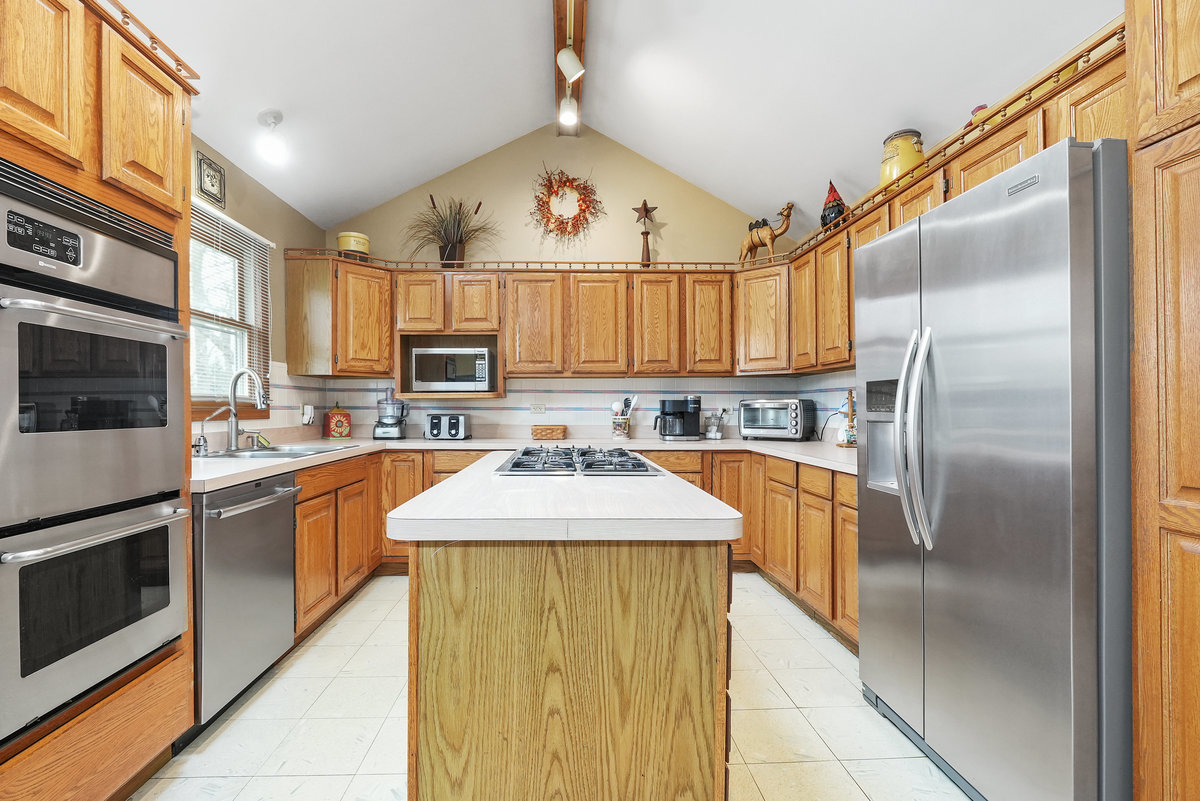 2 Valley View Drive Lemont, IL 60439 - Photo 8 of 36 a kitchen with stainless steel appliances granite countertop a sink stove refrigerator and cabinets