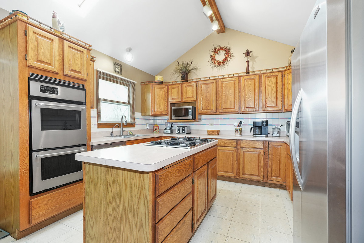 2 Valley View Drive Lemont, IL 60439 - Photo 9 of 36 a kitchen with stainless steel appliances granite countertop a sink and cabinets