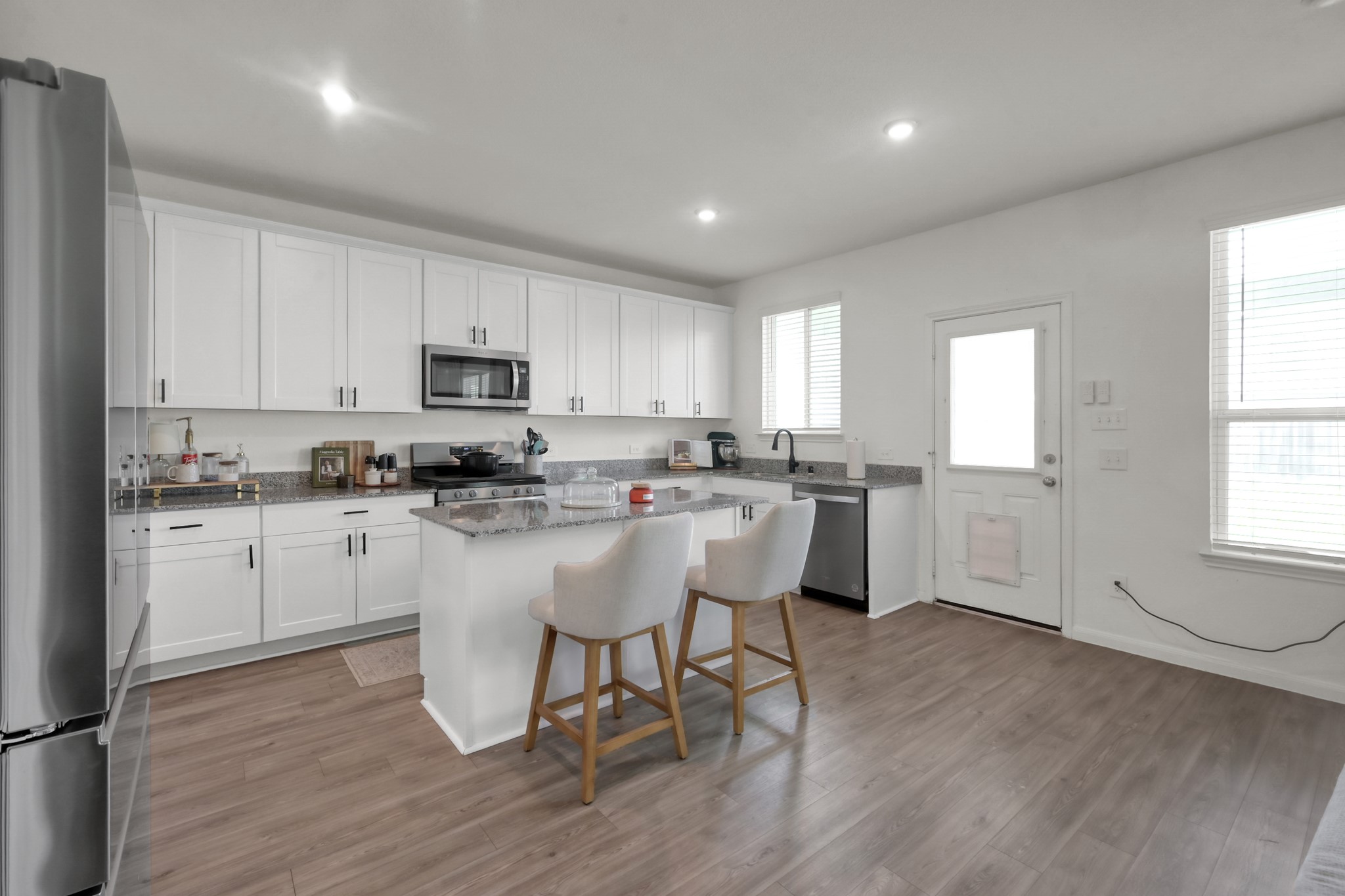 23562 Glenbuck Street Spring, TX 77373 - Photo 11 of 30 a kitchen with a sink cabinets and window