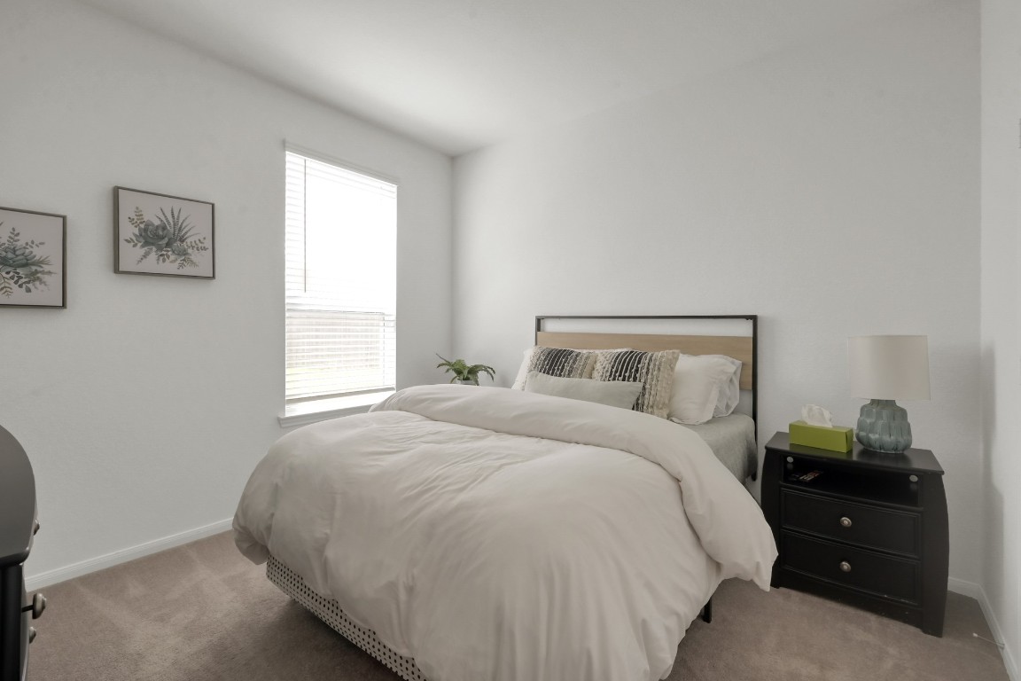 23562 Glenbuck Street Spring, TX 77373 - Photo 12 of 30 a bedroom with a bed and a window