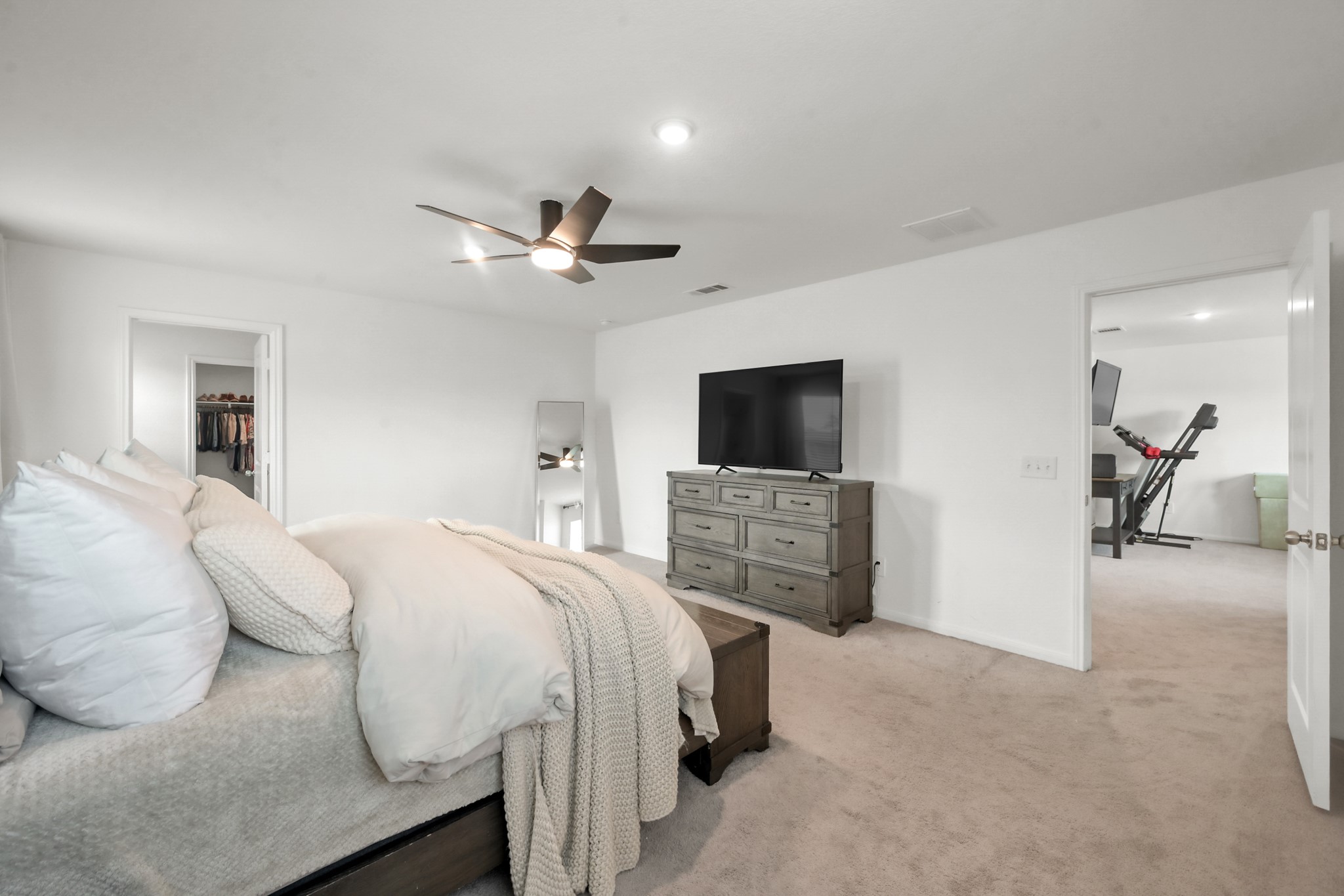 23562 Glenbuck Street Spring, TX 77373 - Photo 18 of 30 a bedroom with a bed and a flat screen tv