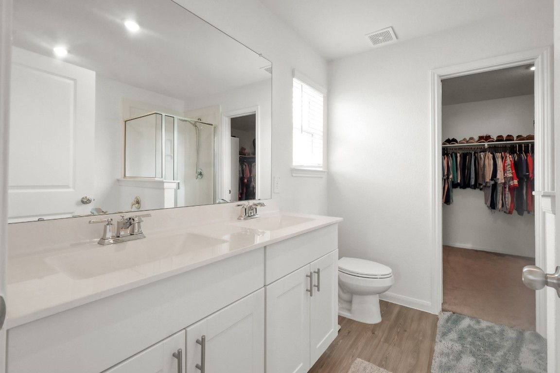 23562 Glenbuck Street Spring, TX 77373 - Photo 19 of 30 a bathroom with a sink a toilet and shower