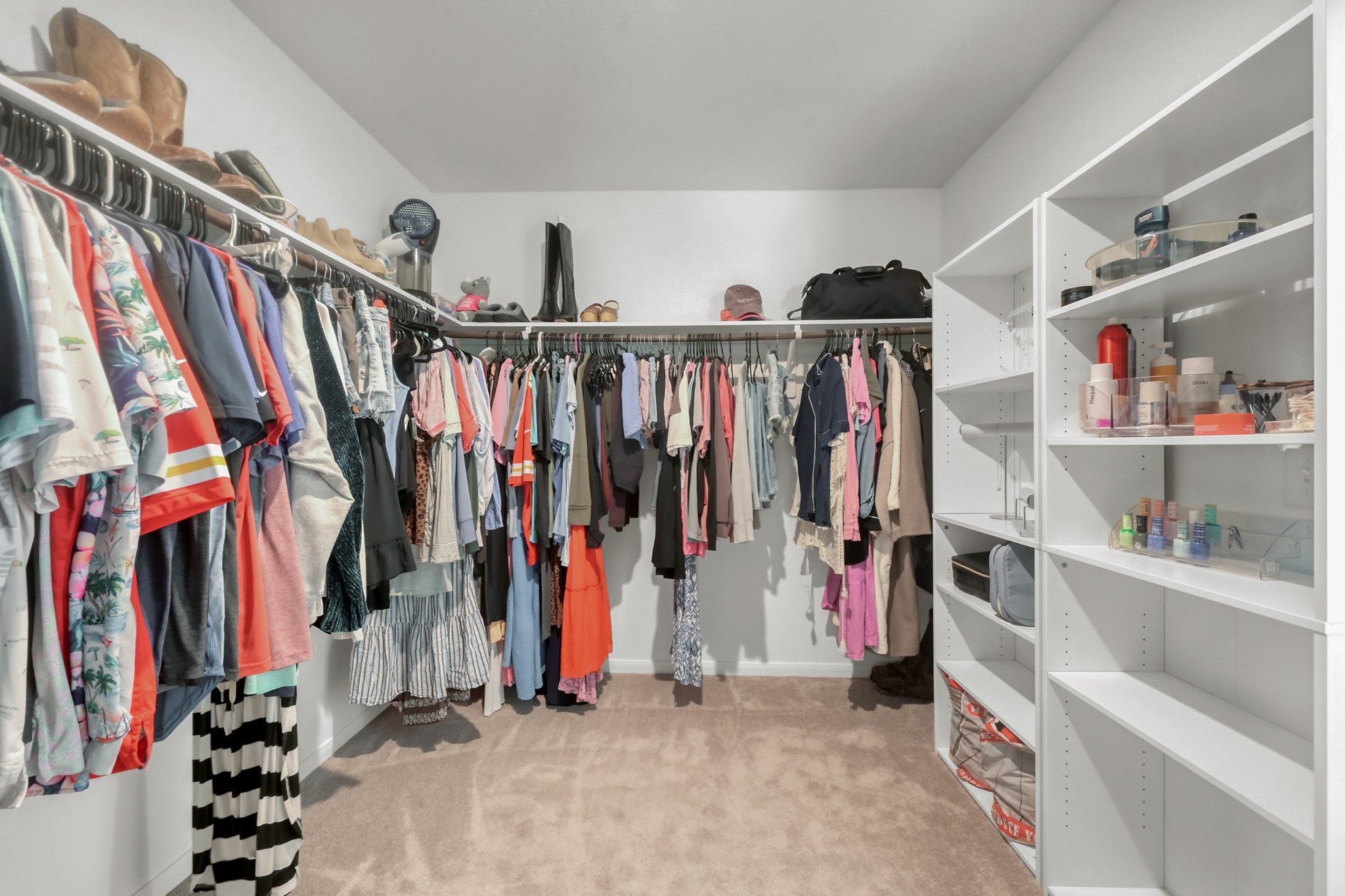 23562 Glenbuck Street Spring, TX 77373 - Photo 22 of 30 a view of walk in closet with clothes and shoes