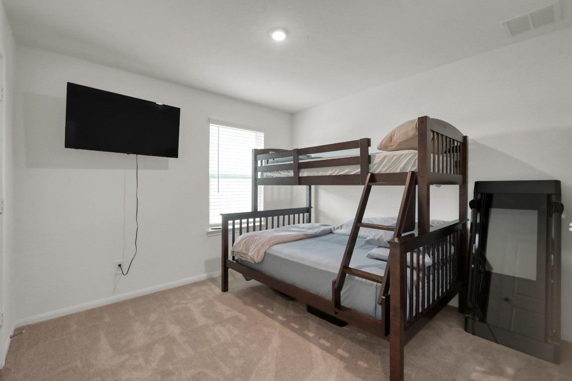 23562 Glenbuck Street Spring, TX 77373 - Photo 23 of 30 a bedroom with furniture