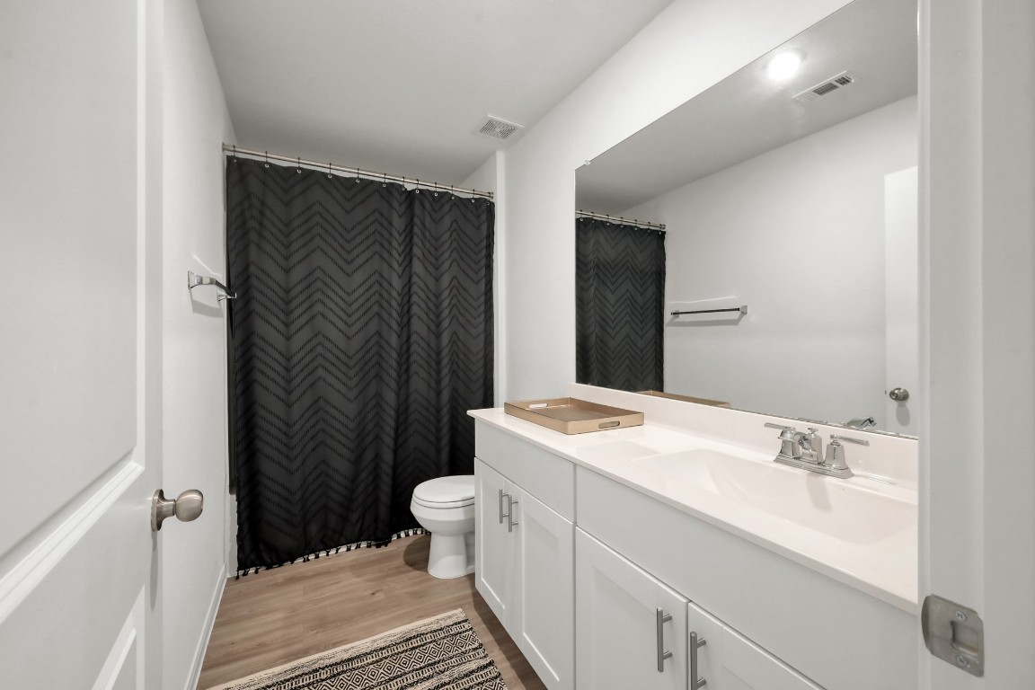 23562 Glenbuck Street Spring, TX 77373 - Photo 24 of 30 a bathroom with a sink and a mirror