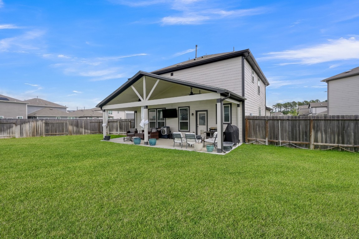 23562 Glenbuck Street Spring, TX 77373 - Photo 28 of 30 a view of a house with a yard porch and sitting area