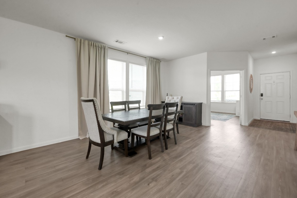 23562 Glenbuck Street Spring, TX 77373 - Photo 7 of 30 a view of a dining room with furniture and wooden floor