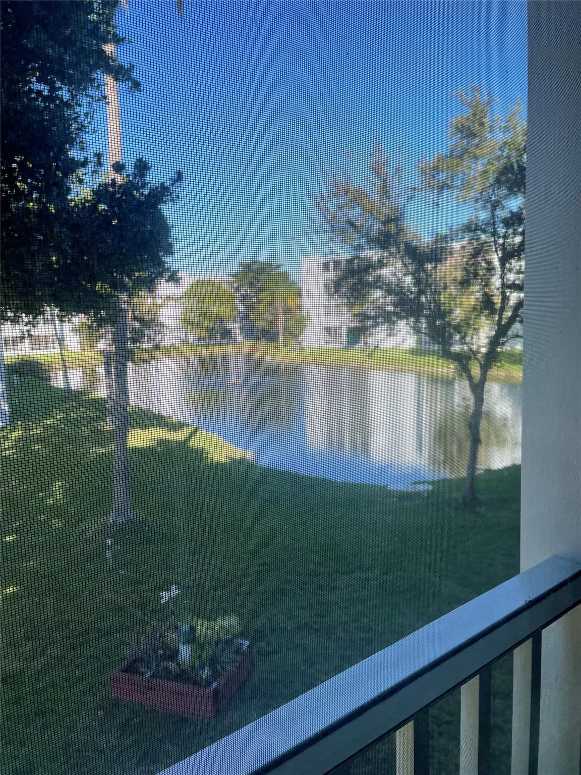 604 Northeast 2nd Street, Unit 231 Dania Beach, FL 33004 - Photo 5 of 18 Looking through the screens on the patio