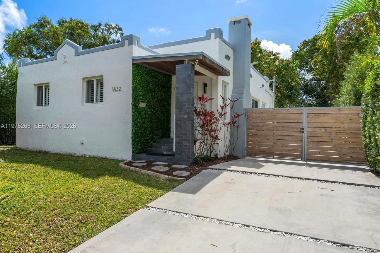 1632 Southwest 12th Street Miami, FL 33135 - Photo 1 of 43 a front view of house with yard