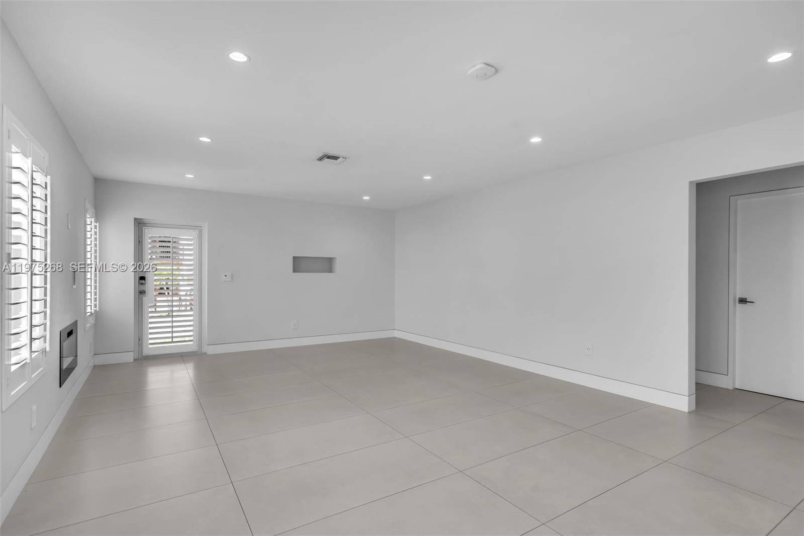 1632 Southwest 12th Street Miami, FL 33135 - Photo 14 of 43 an empty room with windows and closet