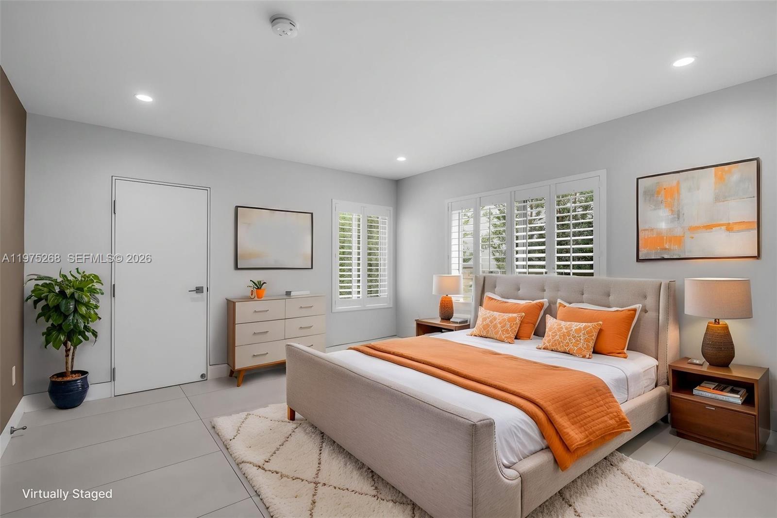 1632 Southwest 12th Street Miami, FL 33135 - Photo 15 of 43 a bedroom with a bed potted plant with the window