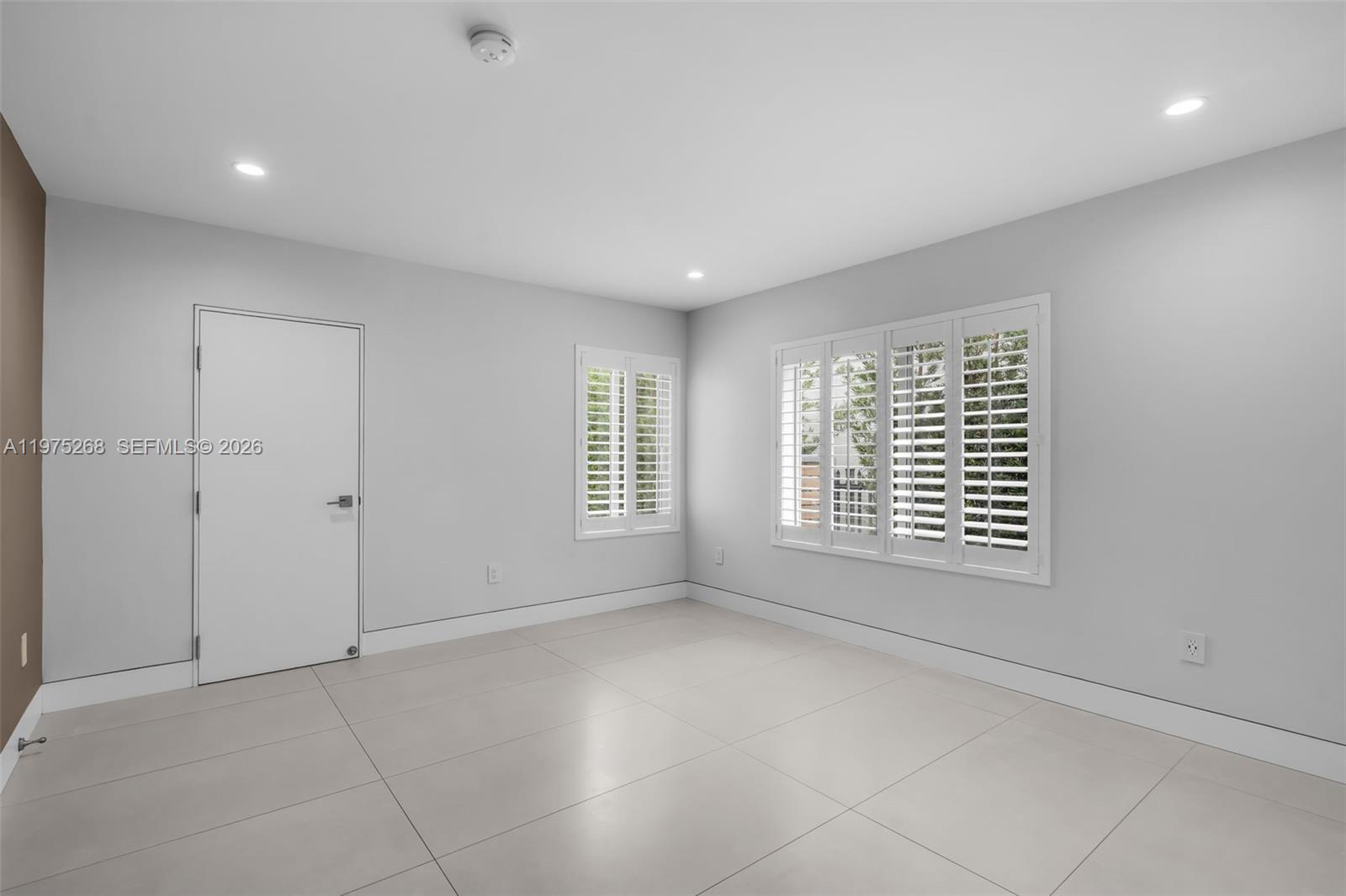 1632 Southwest 12th Street Miami, FL 33135 - Photo 16 of 43 a view of an empty room with a window