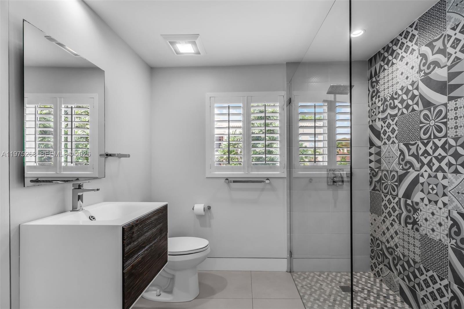 1632 Southwest 12th Street Miami, FL 33135 - Photo 20 of 43 a bathroom with a toilet sink and shower