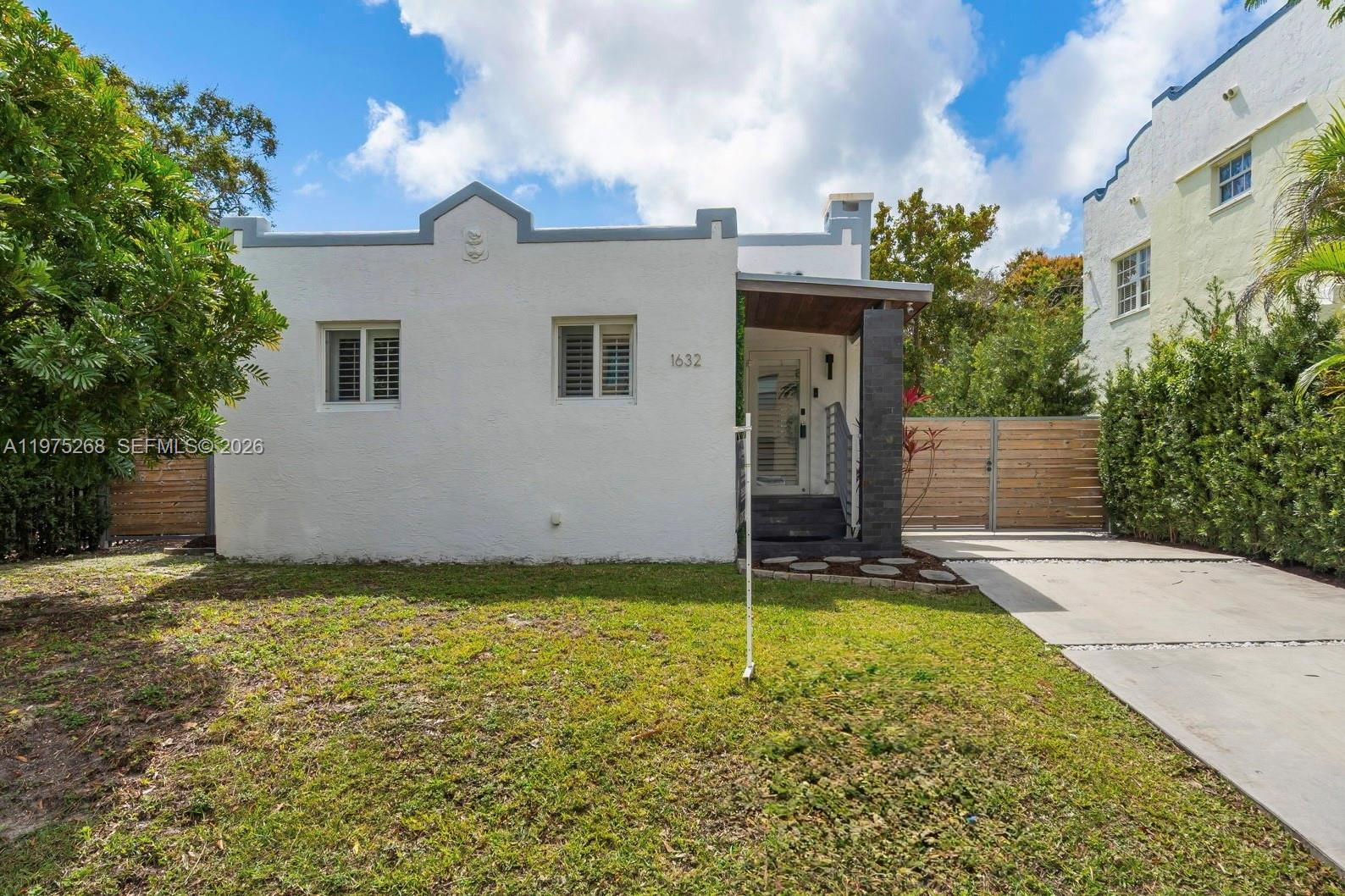 1632 Southwest 12th Street Miami, FL 33135 - Photo 2 of 43 a view of a house with a yard