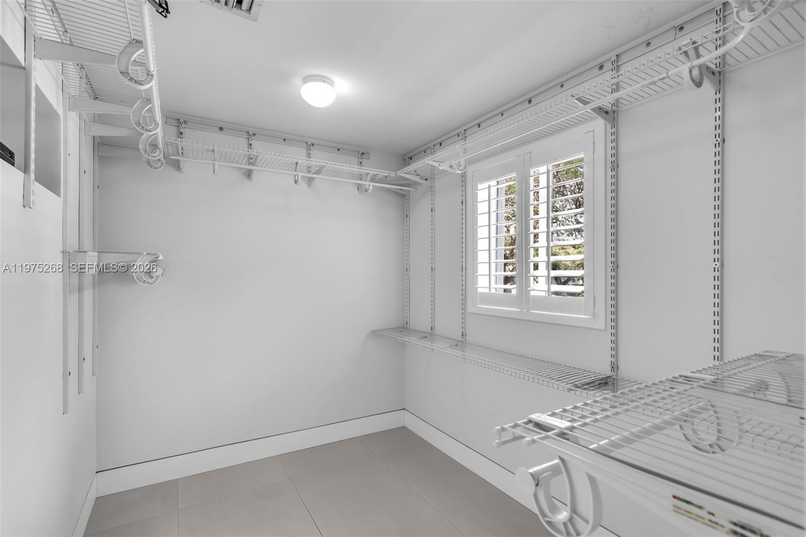 1632 Southwest 12th Street Miami, FL 33135 - Photo 23 of 43 a bathroom with a granite countertop sink a mirror and shower