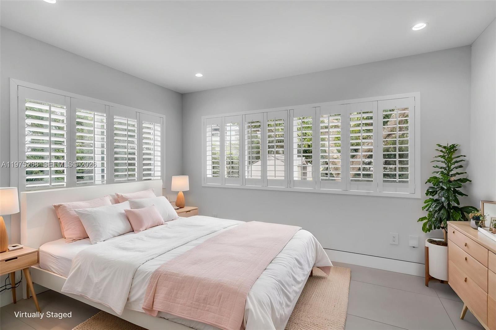 1632 Southwest 12th Street Miami, FL 33135 - Photo 24 of 43 a bedroom with bed and a large window