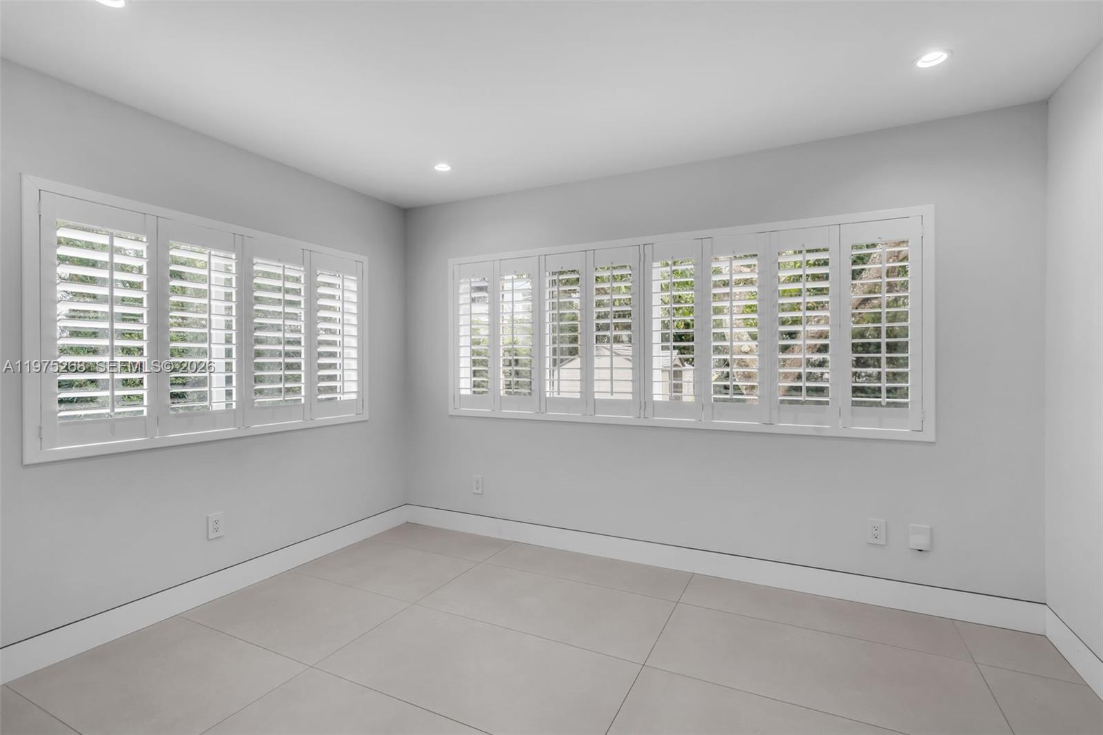 1632 Southwest 12th Street Miami, FL 33135 - Photo 25 of 43 a view of an empty room with a window