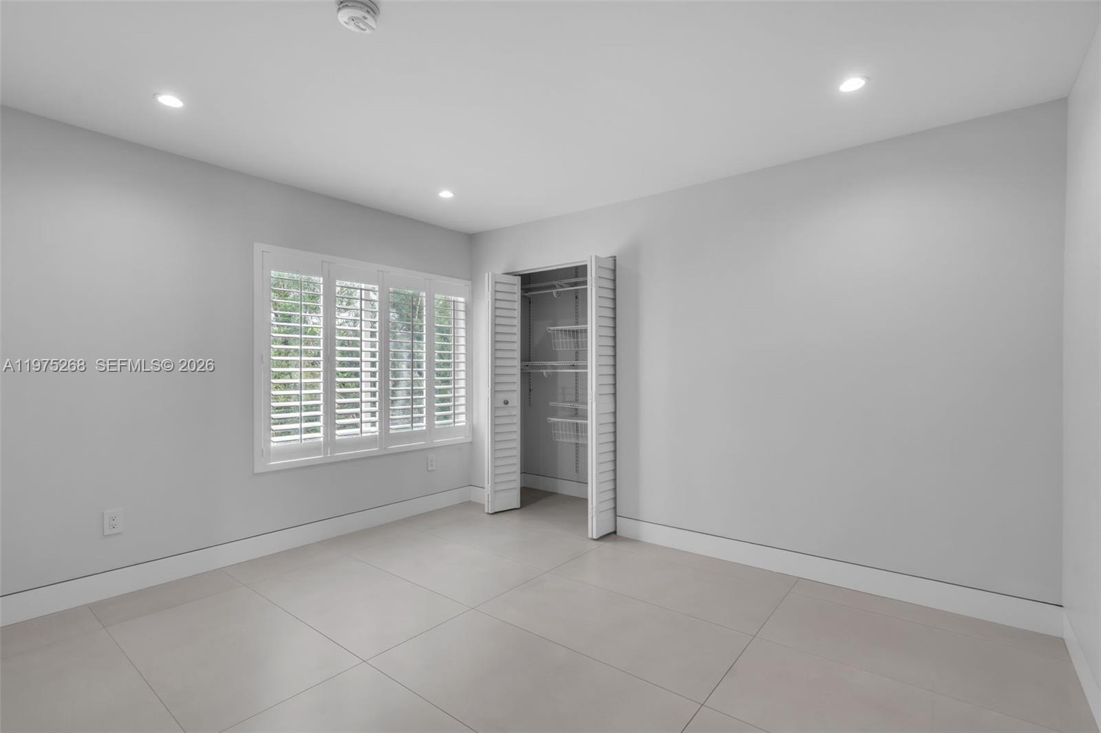 1632 Southwest 12th Street Miami, FL 33135 - Photo 27 of 43 a view of an empty room with a window
