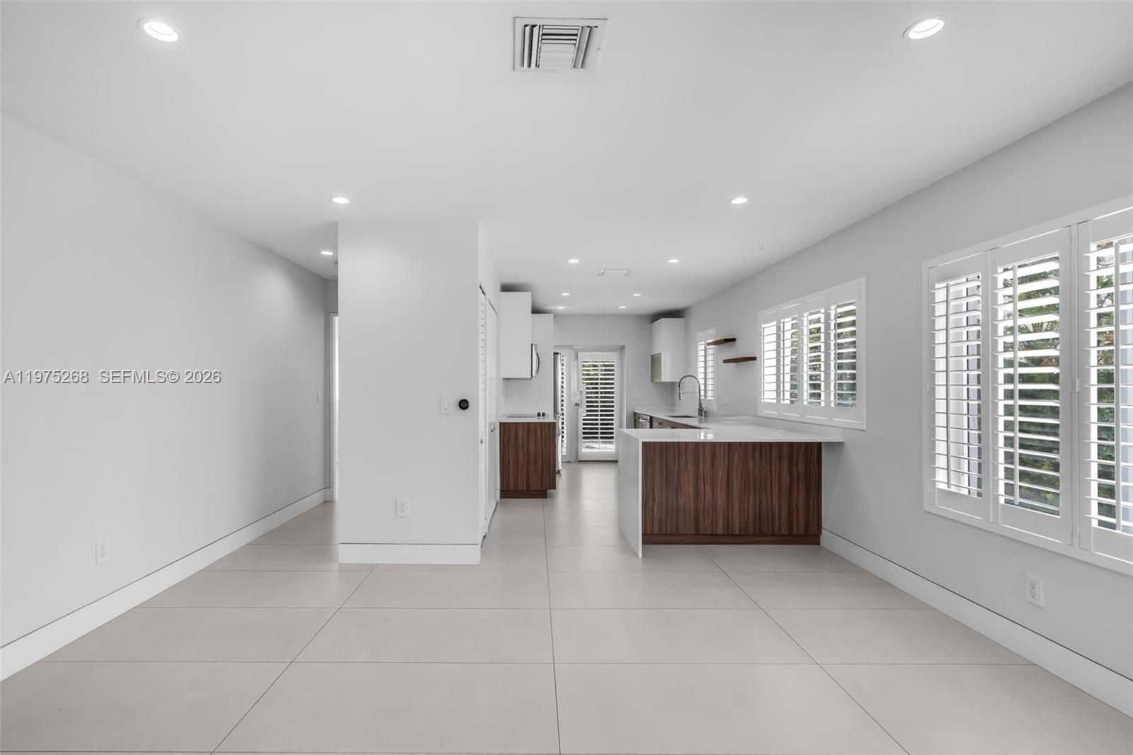 1632 Southwest 12th Street Miami, FL 33135 - Photo 3 of 43 a large bathroom with a large tub shower and window