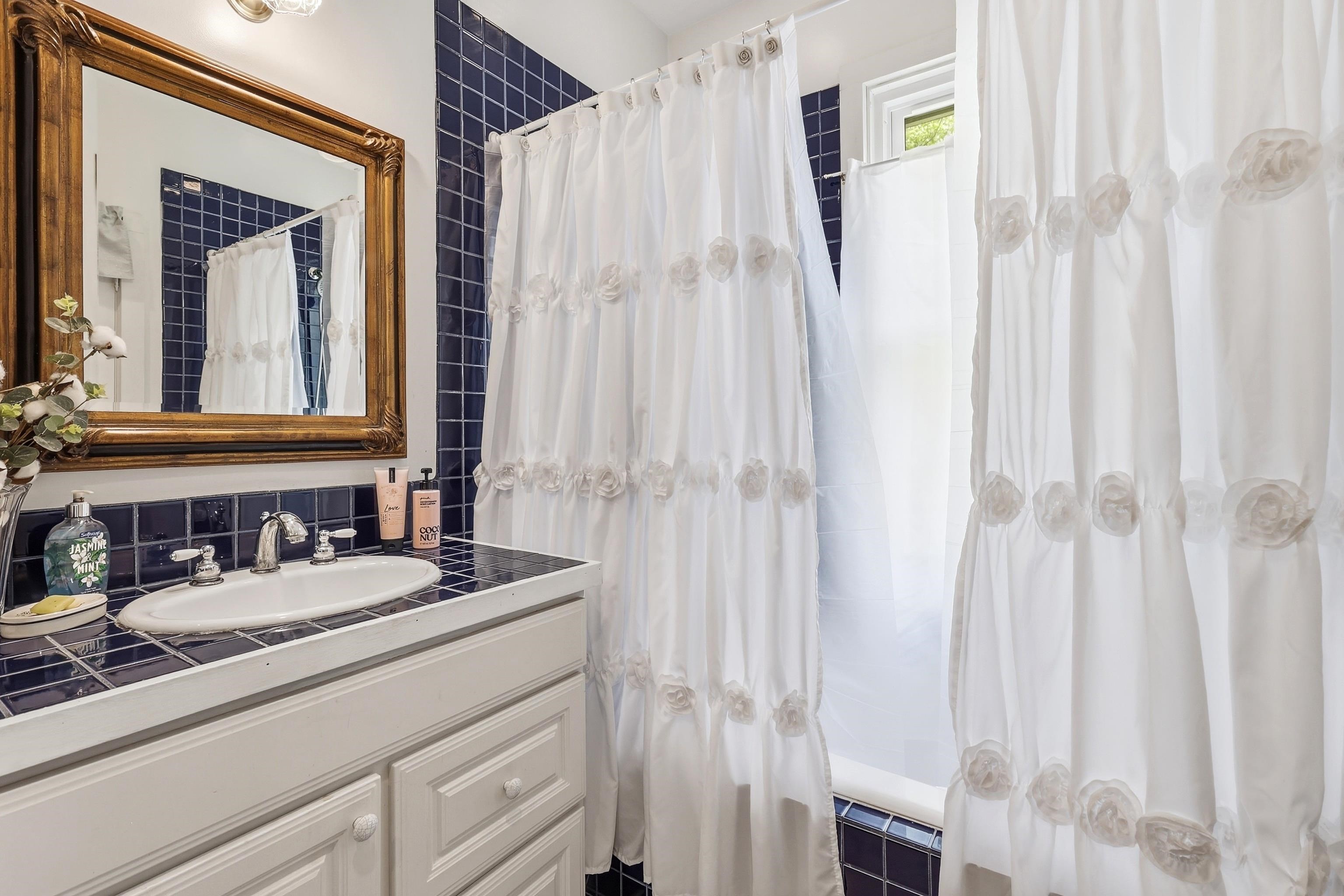 2562 West Blackjack Road Galena, IL 61036 - Photo 47 of 75 a bathroom with a sink and a mirror