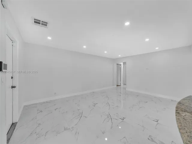 a view of a chandelier fan in a room
