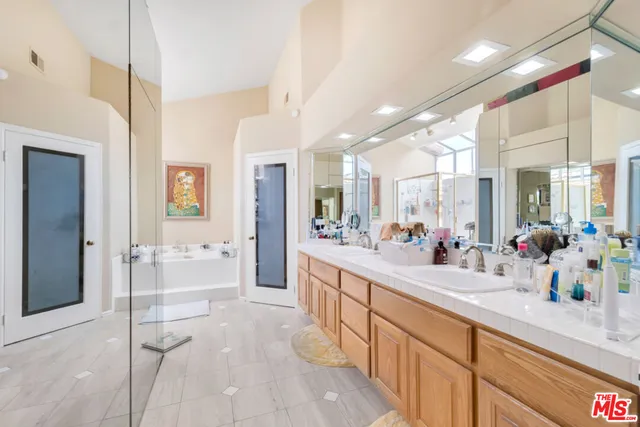 a large white kitchen with a large window