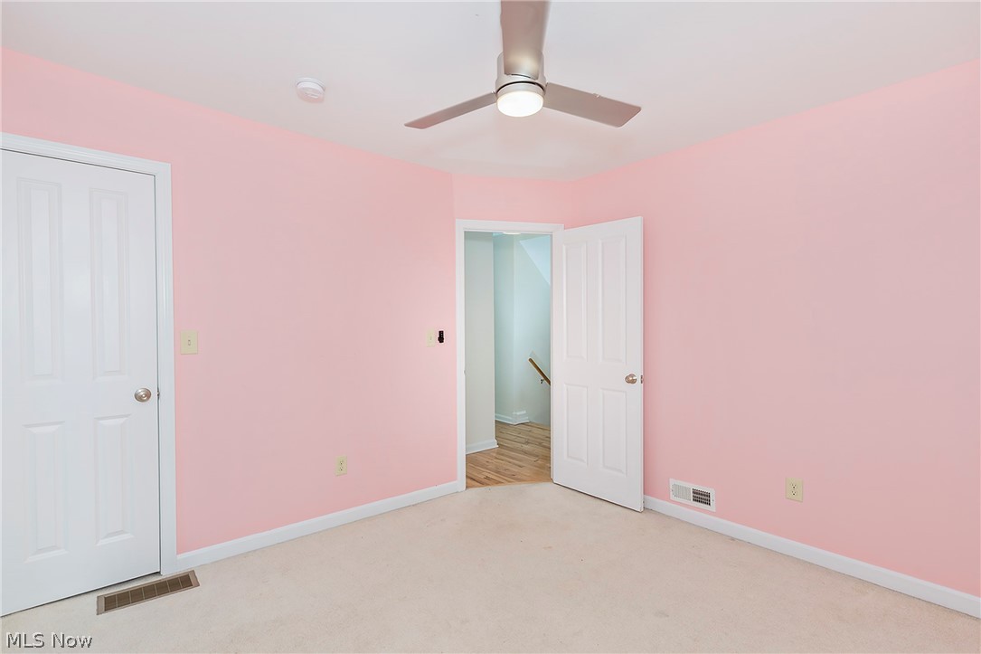 917 Brunswick Road Cleveland Heights, OH 44112 - Photo 27 of 42 Bedroom two with balcony access, closet and ceiling fan.