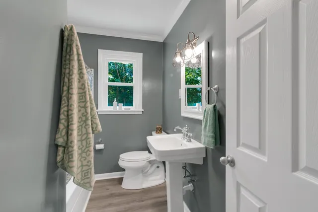 a view of room with window and wooden floor