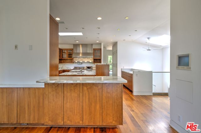 a view of a livingroom with furniture and a flat screen tv
