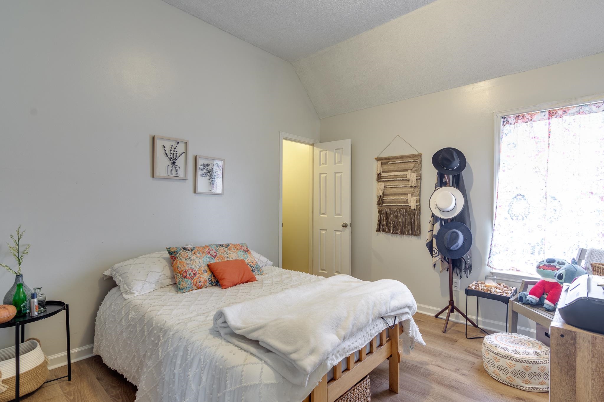 7314 Patsy Circle North Memphis, TN 38125 - Photo 18 of 28 Bedroom with vaulted ceiling and wood finished floors