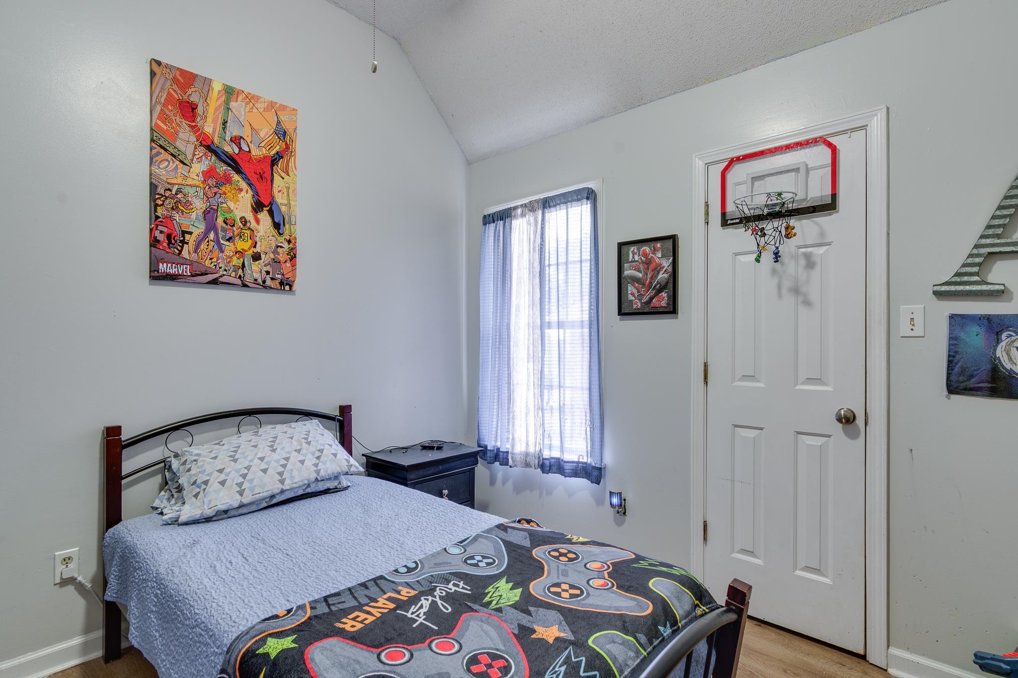 7314 Patsy Circle North Memphis, TN 38125 - Photo 20 of 28 Bedroom with lofted ceiling and light wood-style flooring
