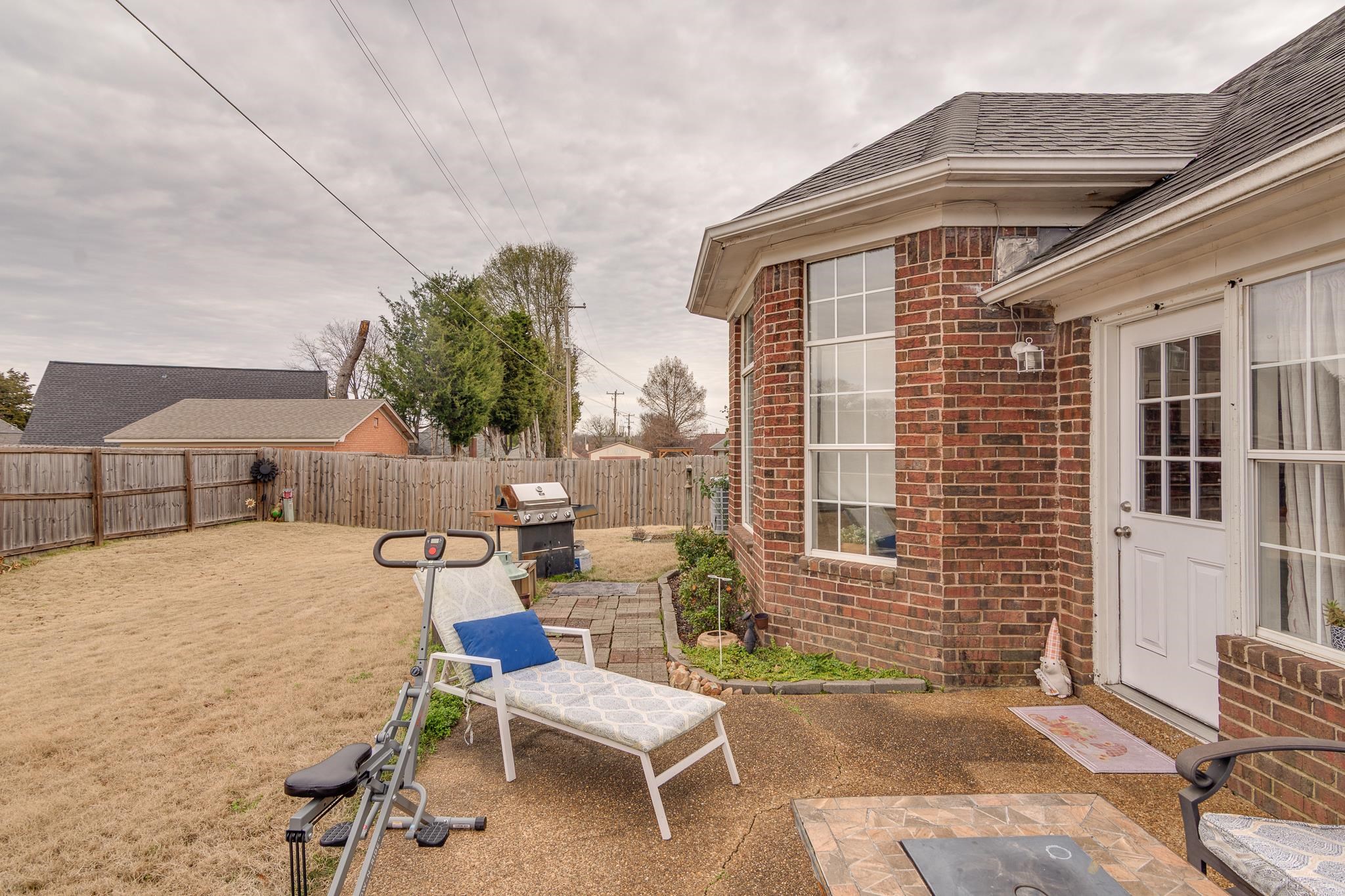 7314 Patsy Circle North Memphis, TN 38125 - Photo 24 of 28 Fenced backyard featuring a patio and grilling area
