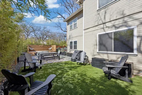 a backyard of a house with outdoor seating