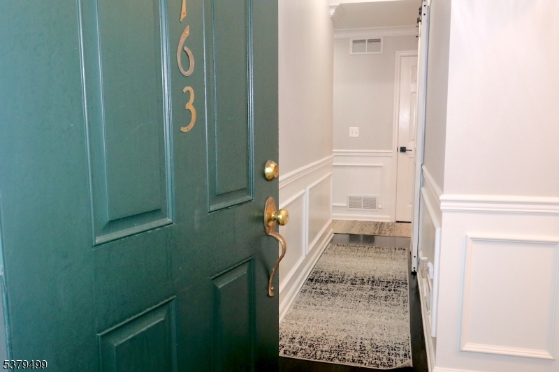 163 Conover Terrace, Unit 163 Lebanon, NJ 08833 - Photo 13 of 15 a bathroom with a granite countertop sink and a mirror