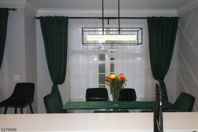 a room with furniture and a potted plant