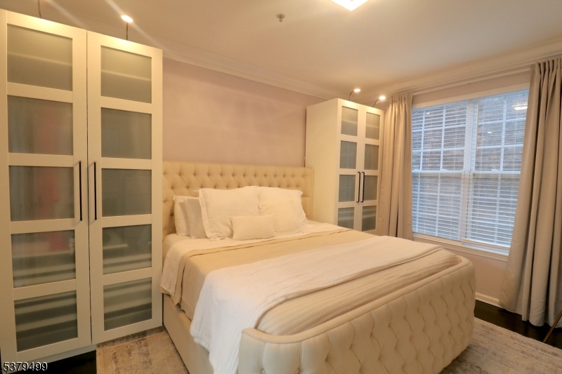 163 Conover Terrace, Unit 163 Lebanon, NJ 08833 - Photo 2 of 15 a bedroom with a bed and a window