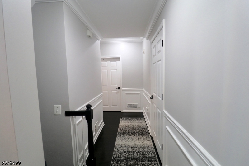 163 Conover Terrace, Unit 163 Lebanon, NJ 08833 - Photo 9 of 15 a view of a bathroom with a sink and a wooden floor