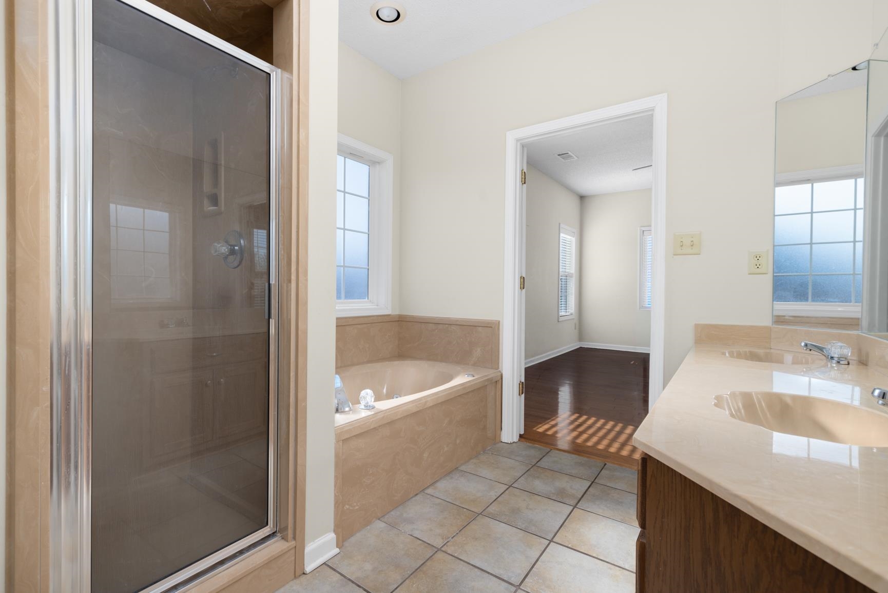471 Farmer Trail Atoka, TN 38004 - Photo 20 of 35 a bathroom with a sink a mirror and a bathtub